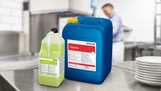 Two Ecolab machine liquid specialty products, from left to right; Lime-A-Way Extra and Trump Des