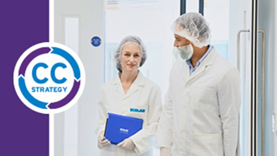 An Ecolab technician with a client in a cleanroom